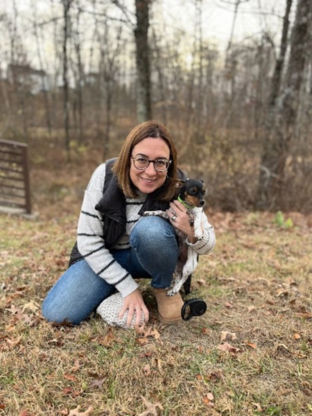 Amy Melchior is pictured out walking with her dog.