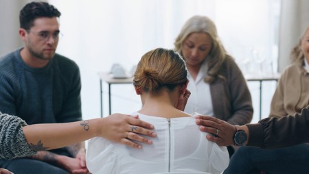 Woman in group grief counseling after a loss 