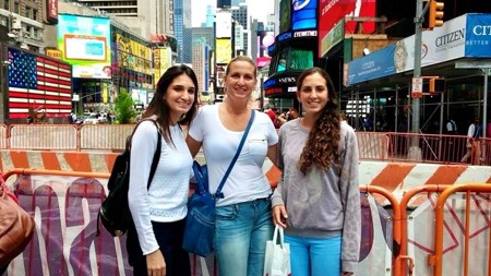 Sharon Biran is pictured with her two daughters on their holiday to New York.