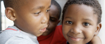 little boys hugging smiling