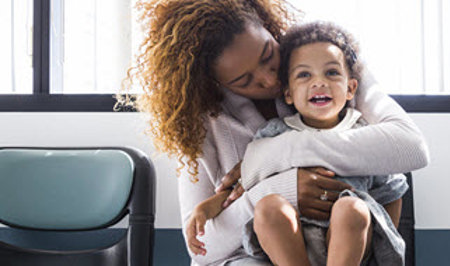 woman-sitting-holds-son