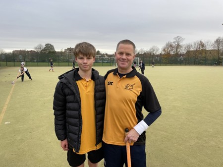  Cystic fibrosis patient Tim Wotton and his son, Felix, playing hockey together. Photo by Tim Wotton. 