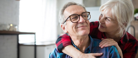 Man being hugged and comforted by his wife as he deals with worries about heart failure.