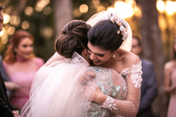 Mother with ADHD is proud as she hugs her newly married daughter