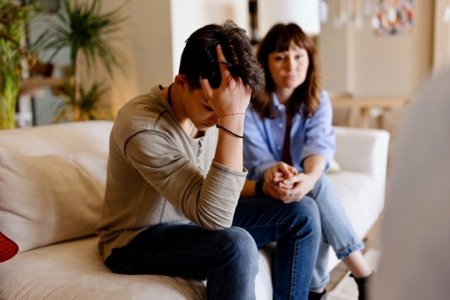 Katarzyna & Patryk, Mom sitting with and caring for her teenage child with psychosis and schizophrenia 