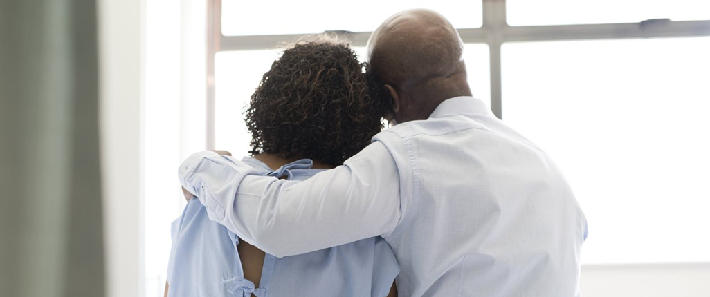 Father embracing his daughter in psychiatric hospital