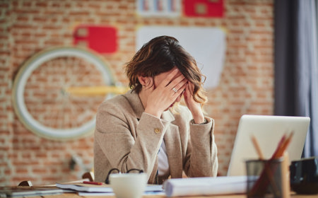woman-holding-head-worried