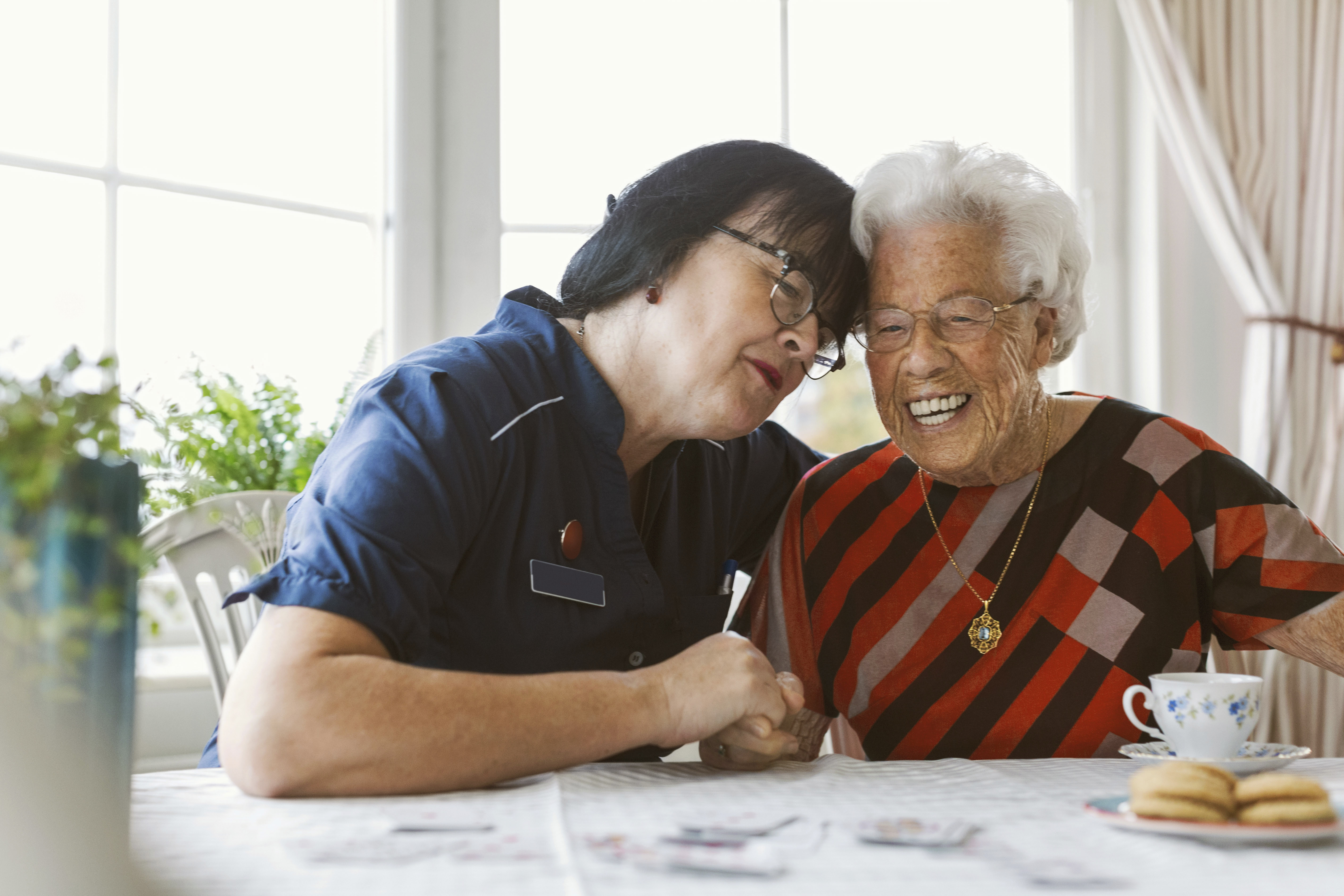 Caregiver hugging patient