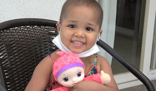 baby sitting with a doll